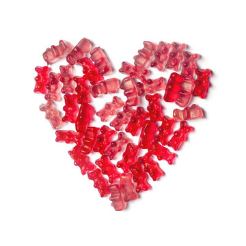 Colorful jelly gummy bears candy in the shape of heart on white background, symbol of sweet love