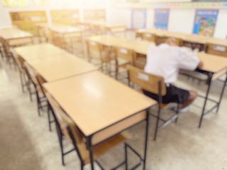 blurred image of one student sleeping in classroom