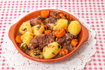 rustic meal of ox tail with potato and carrot