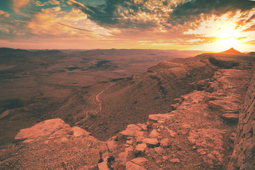 Beautiful dramatic sunset over the desert. Nature landscape. Makhtesh Ramon Crater, Israel