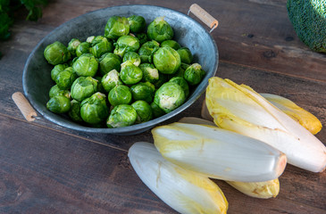 sprouts and endives on wooden background, Belgian vegetables