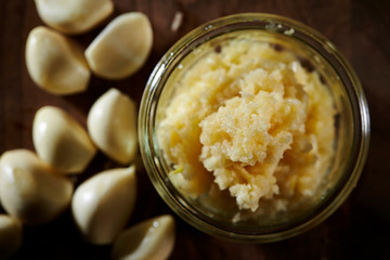 Crushed garlic in plastic bowl 