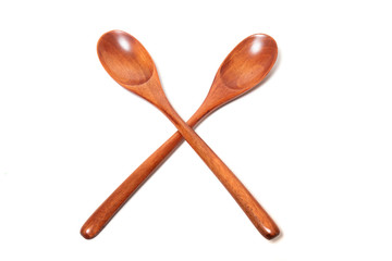 wooden spoons over white background