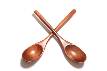 wooden spoons over white background