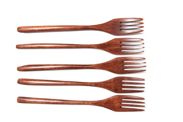 wooden forks over white background