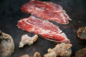 Cooking beef on iron plate 