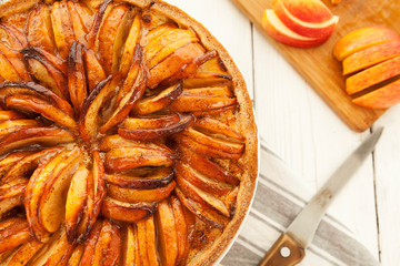 Tart with an apple. Freshly baked open apple pie. Gourmet pastries, traditional European cuisine.