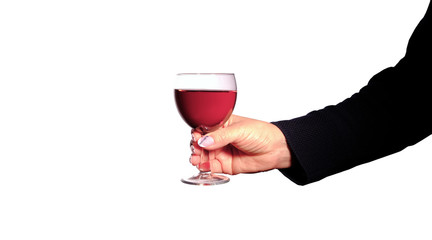 a glass of red wine in a female hand
