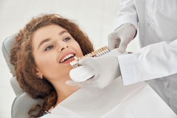 Charming girl visiting dental clinic for whitening procedure