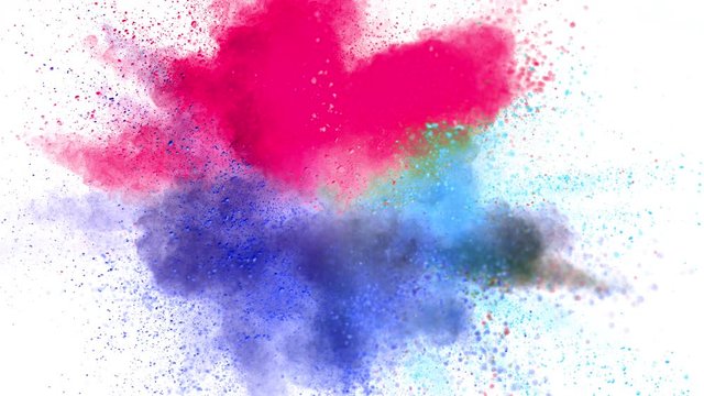 Colorful powder exploding on white background in super slow motion, close-up.