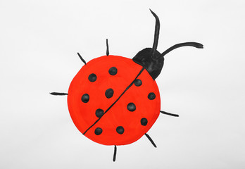 Child's painting of ladybug on white paper © New Africa
