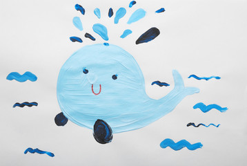 Child's painting of whale on white paper