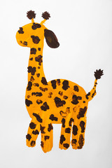 Fototapeta na wymiar Child's painting of giraffe on white paper