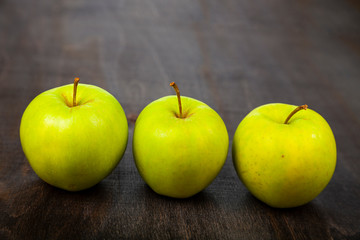 Three green apples