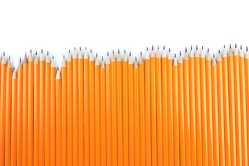 Close up view of a bunch of yellow pencils isolated on a white background. - Image