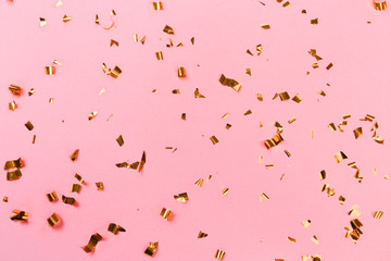 Golden stylish decoration on pink background. Place for text. Festive concept. - Image