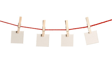 Set of blank notes held on string isolated