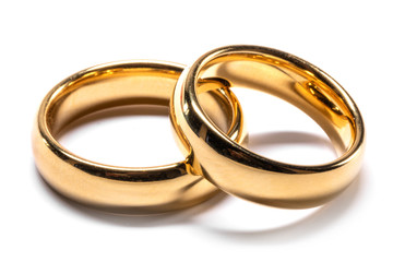 Gold wedding rings on white - obrazy, fototapety, plakaty