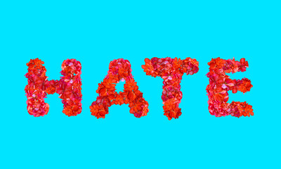 Hate text in capital letters using flowers to layout font on solid background