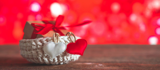 Valentine's day, wedding zero waste, eco-friendly gift wrapping kraft paper and branches with hearts, gift basket, cozy winter winter evening eco concept eco-friendly banner decor