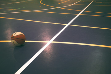 Very colorful basketball court with basketball, with white line standing out from the others.Sports concept