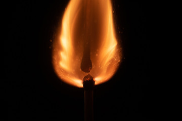 Ignition of match with sparks isolated on black background space for text fire concept passion figures variety