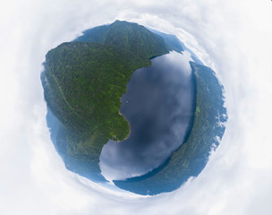 360 degree panoramic aerial drone view of planet earth in the form of a ball with the image of...