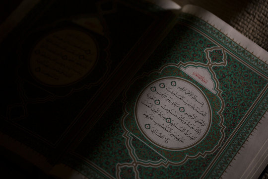reading the Holy Qur'an, shooting close up with f 1.2