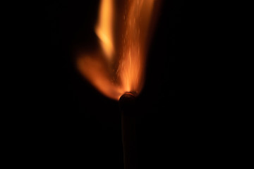 Ignition of match with sparks isolated on black background space for text fire concept passion...