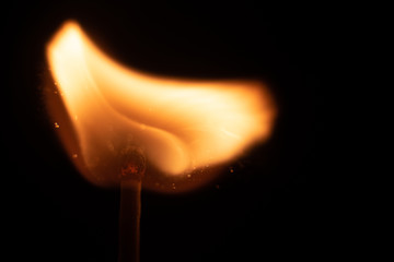 Ignition of match with sparks isolated on black background space for text fire concept passion...