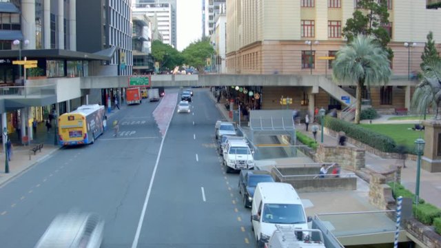 Fast moving traffic hyperlapse with people in Brisbane city, Adelaide street, Australia.
