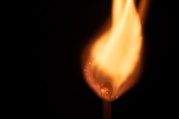 Ignition of match with sparks isolated on black background space for text fire concept passion figures variety