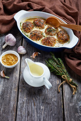 rabbit ballotine in a ceramic baking dish