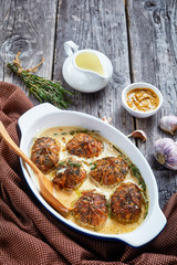 rabbit ballotine in a ceramic baking dish