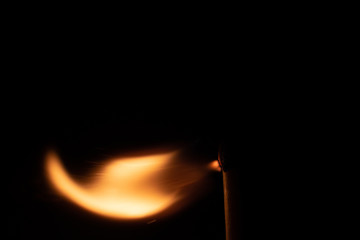 Ignition of match with sparks isolated on black background space for text fire concept passion...