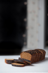 Fresh brown bread slice isolated on white background