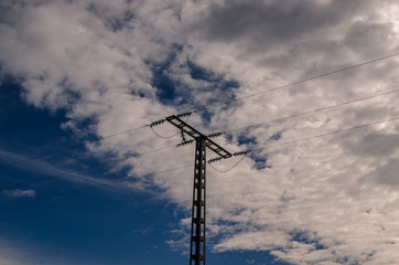 high voltage tower in the sky