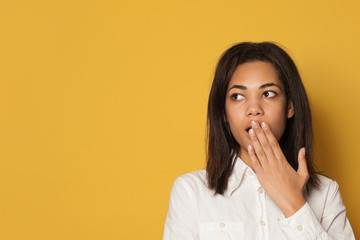 Shocked woman in white shirt looking aside close up portrait