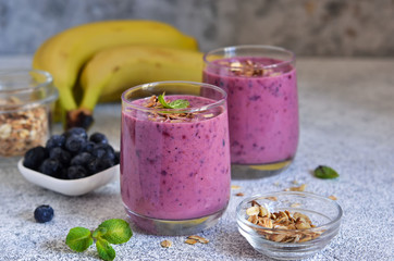 Banana, blueberry and granola smoothies. Detox menu.