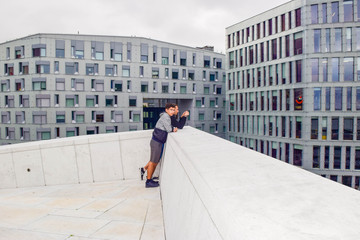 Man and guy on the roof of Oslo Opera House. Norway.