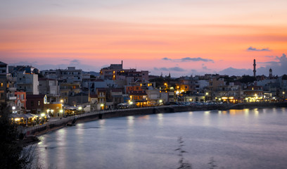 Fototapeta na wymiar sunset light relflections in the bay of chania on the greek island of crete