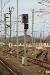 Railroad crossing sign against a blue sky