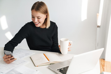 Business woman in office indoors work with phone