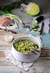 cabbage ham salad in ceramic bowl. selective focus