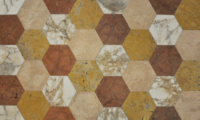 Color marble from hexahedron as a background. Modern hexagonal paving tiles from natural stone