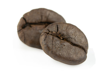 Close up coffee beans isolated on white background with clipping path.