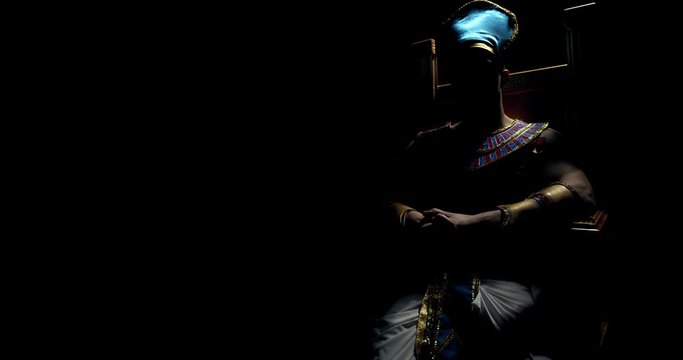 Silhouette of an ancient pharaoh in egyptian clothes sitting on a throne, 4k