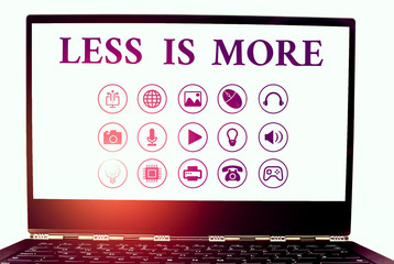 Conceptual hand writing showing Less Is More. Concept meaning Minimalist approach to artistic...