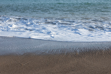 Obraz premium beach sands and sea waves