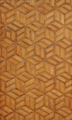 Texture of a wooden wall panel with a geometric hexagon pattern. Natural wood background 

